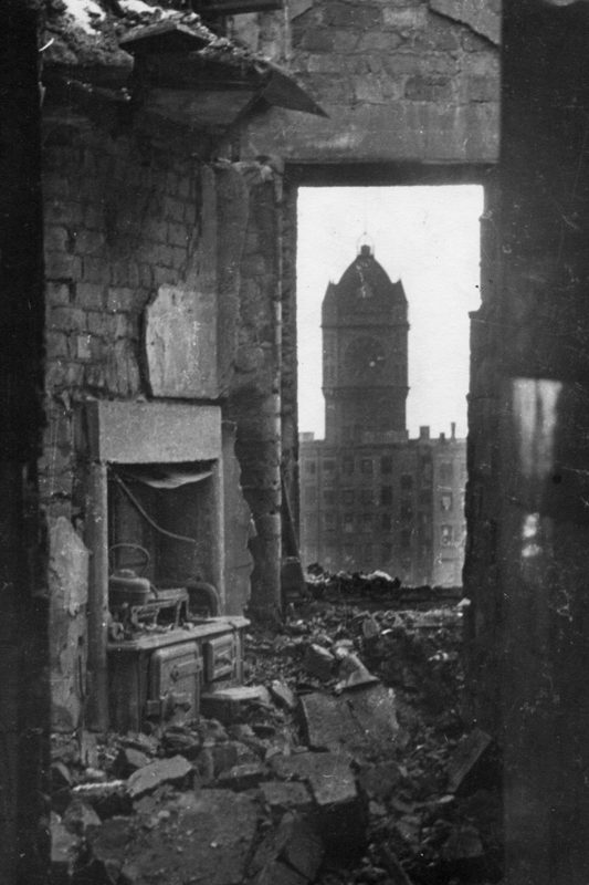 image of A Blitz damaged building in the 'Holy City' with the Singer clock in the background, 1941.