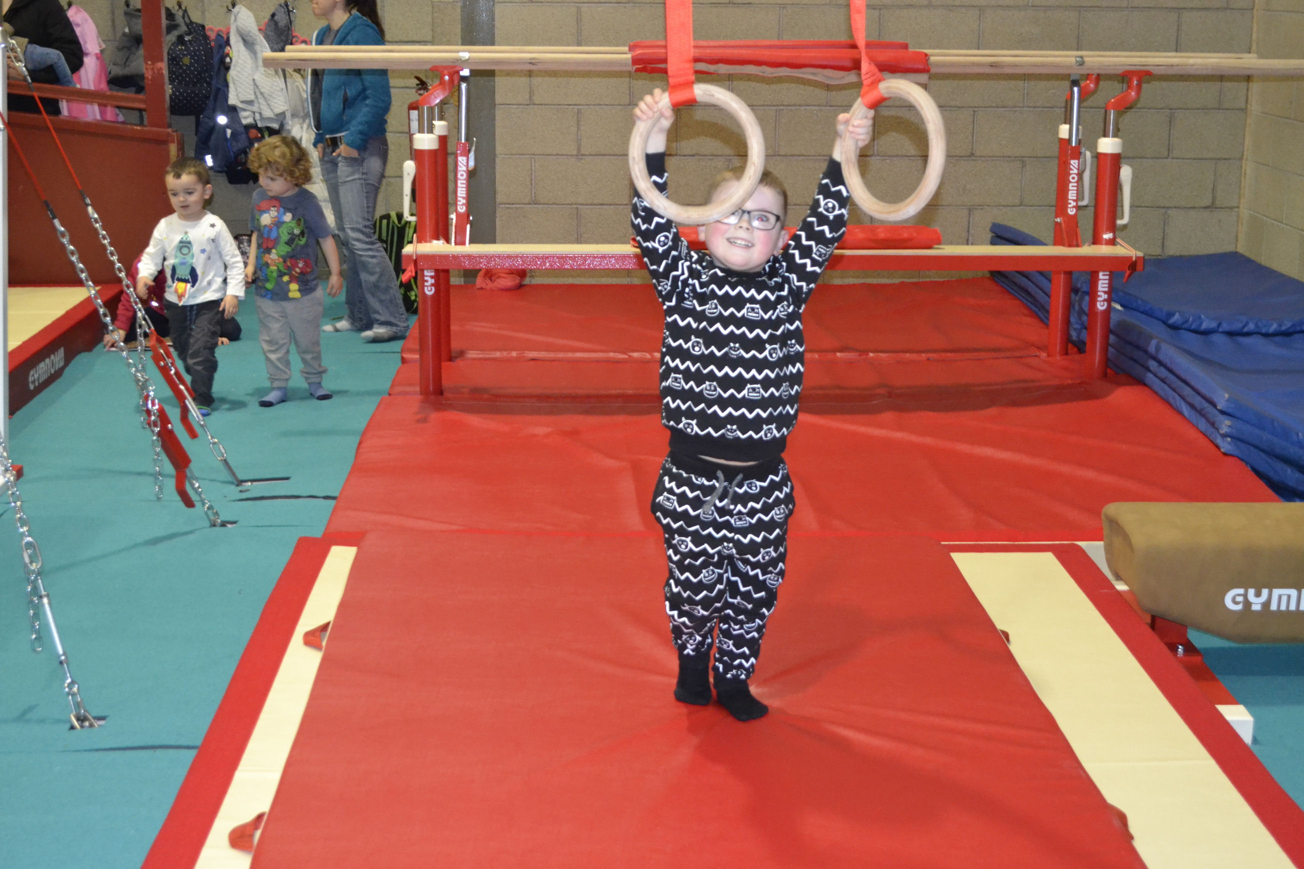 image of Gymnastics - boy holding the rings